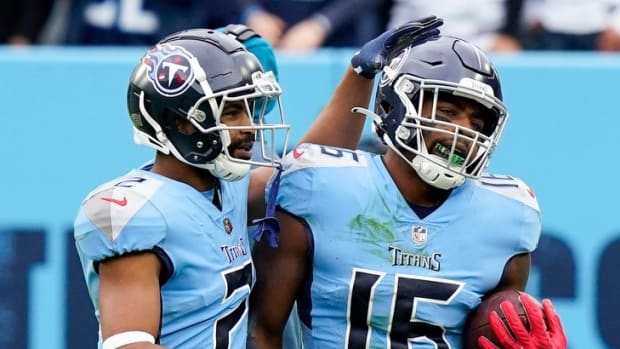 Tennessee Titans wide receiver Treylon Burks (16) is congratulated by wide receiver Robert Woods (2) after he scored a touchdown off a Derrick Henry fumble as they face the Cincinnati Bengals during the second quarter at Nissan Stadium Sunday, Nov. 27, 2022, in Nashville, Tenn.